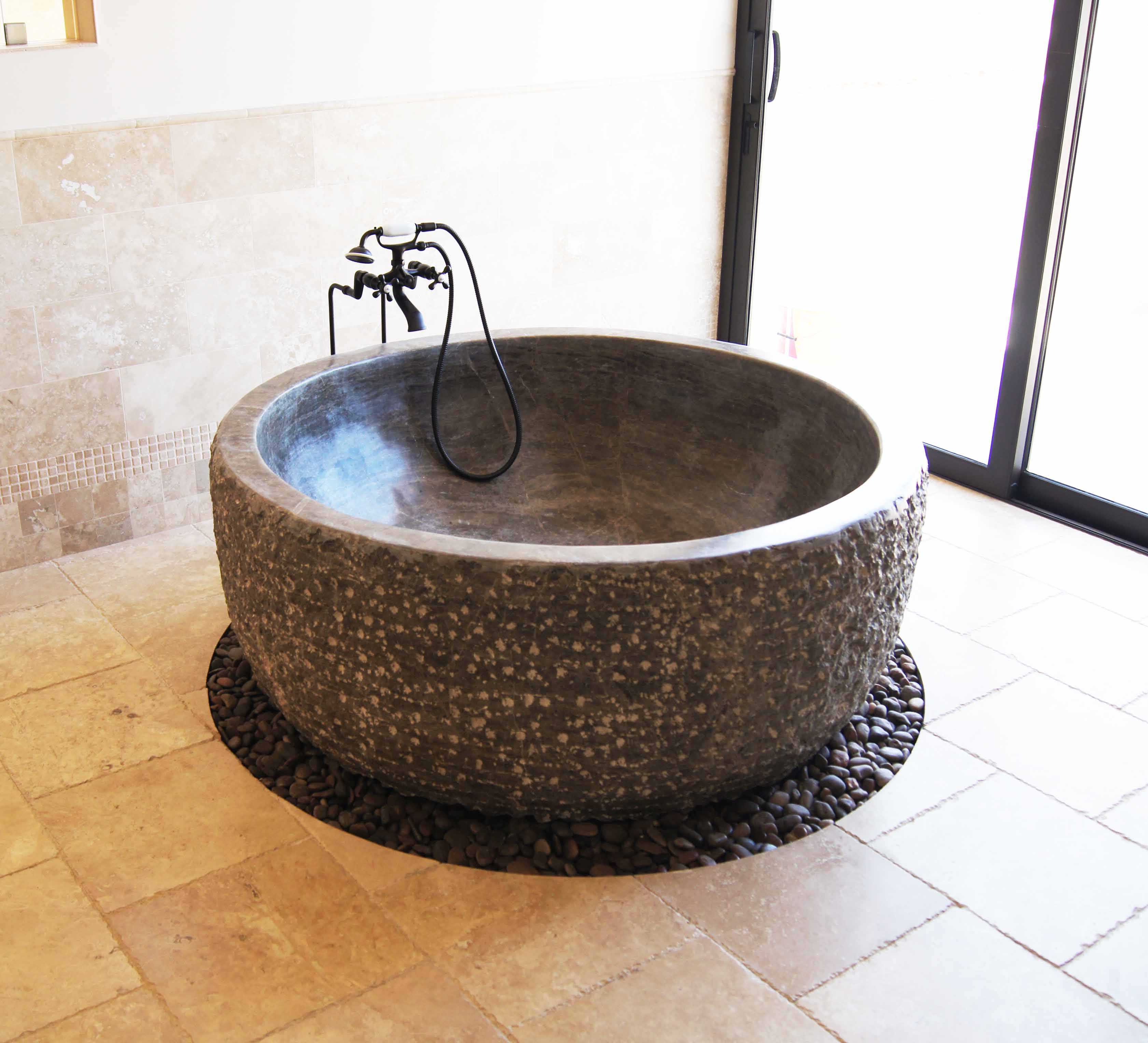 Chiseled outside with polished inside round stone tub